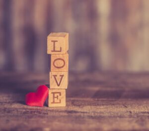 Blocks stacked on top of each other spelling "love."